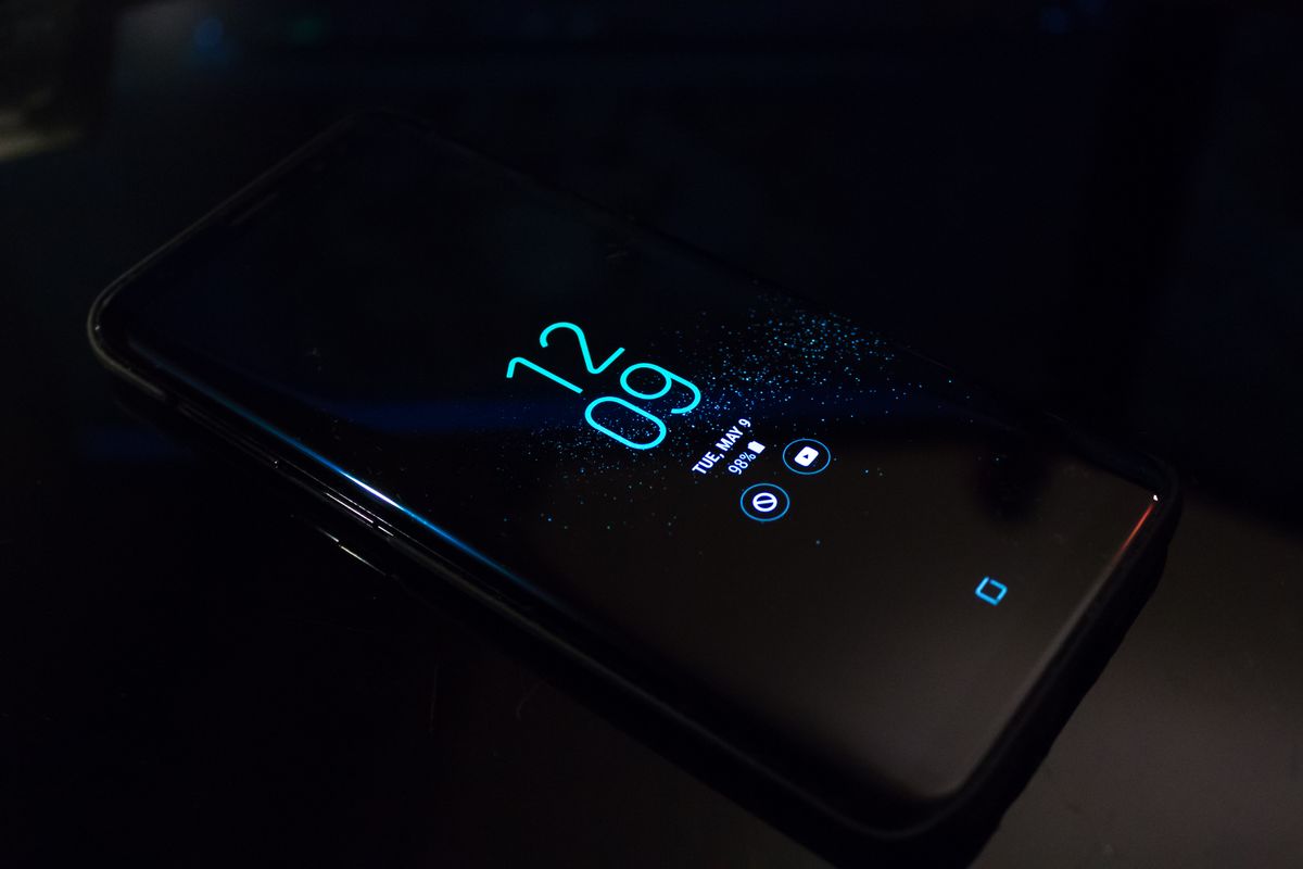 A smartphone on a dark surface