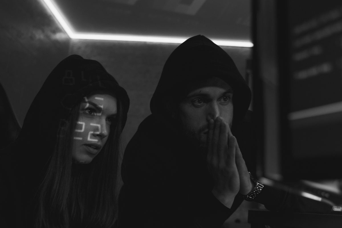 Actors in a staged cybersecurity photograph