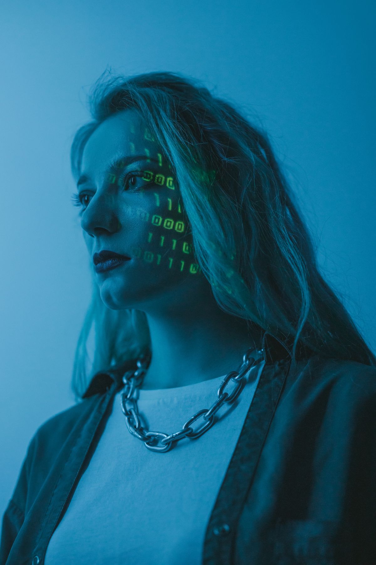 A portrait with projected digital text — conceptual stock photograph