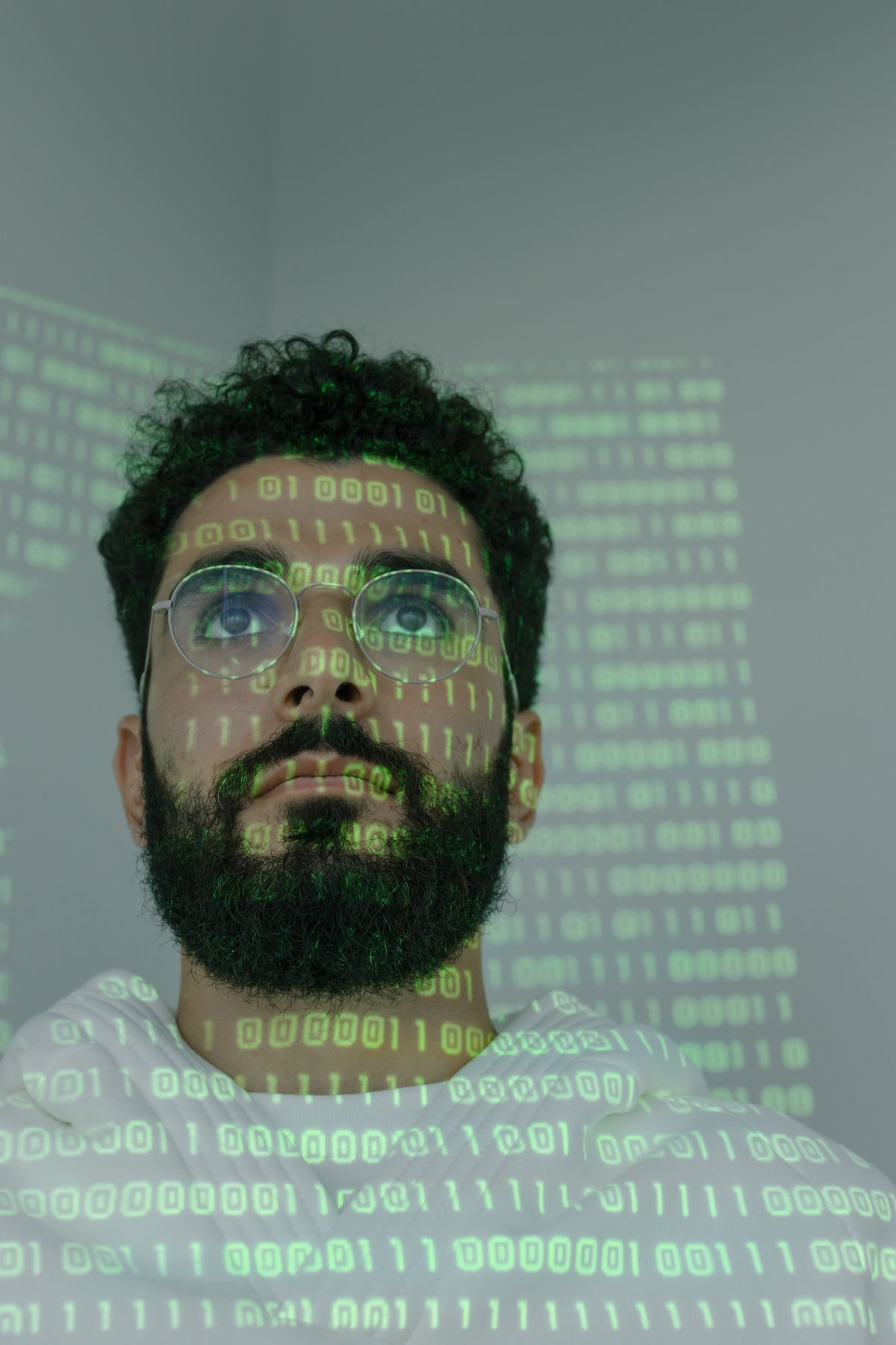 A face with projected code — conceptual stock photograph